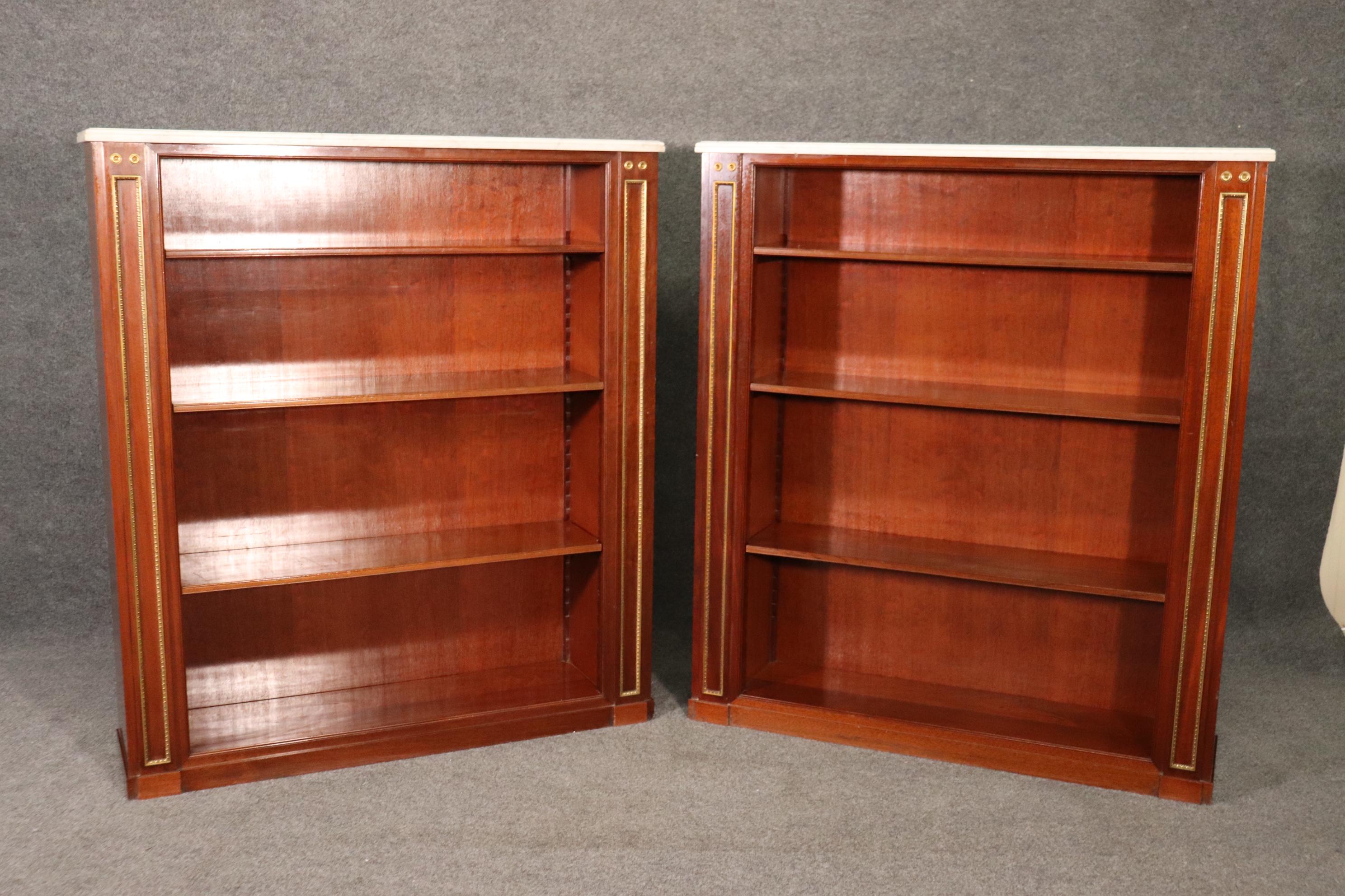 Maison Jansen made some of the world's most chic furniture and designed to replicate the earlier styles of the past and blend them with a more practical design for today. These bookcases measure 45 wide x 11.5 deep x 51 tall. They date to the 1950s