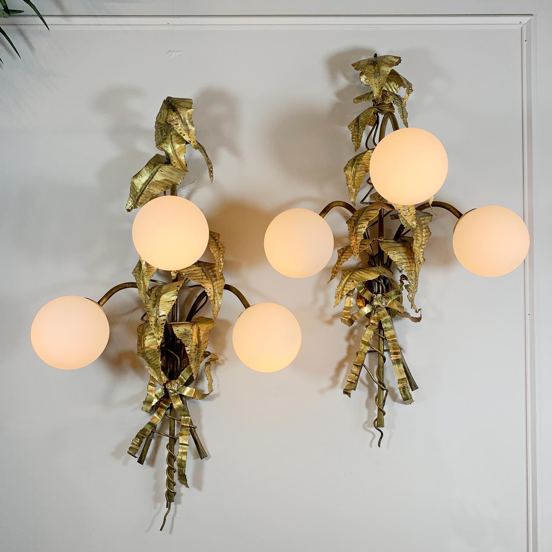 An absolutely outstanding and very rare pair of large Italian brass leaf wall lights by the renowned sculptor and designer P. Mas.Rossi The decorative opaque glass globe shades each hide a single e14 bulb holder, each light has three lamp holders,