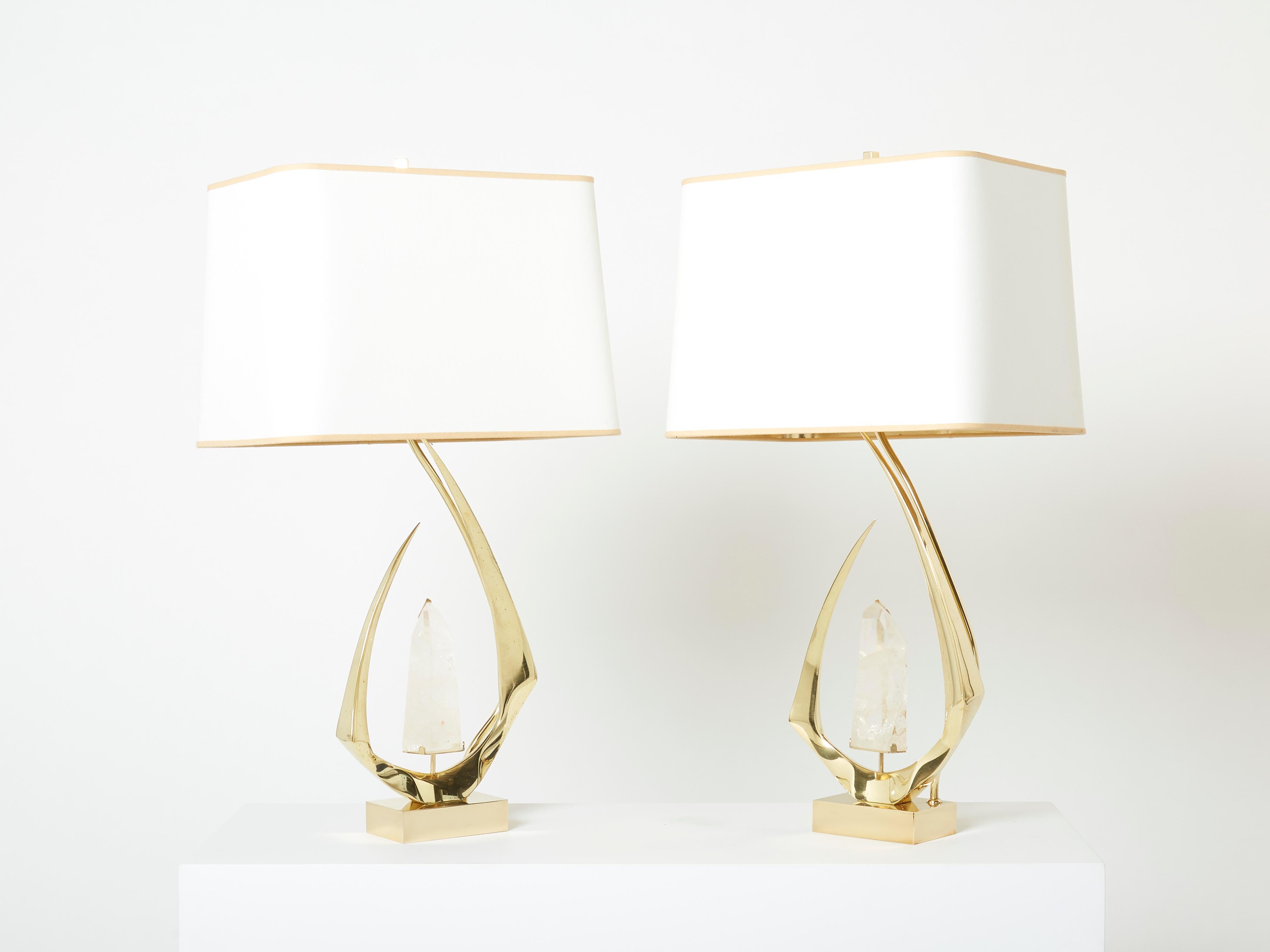 This pair of vintage table lamps has the intricacy of fine jewelry. Brass is sculpted and curved to look miraculously molten and gravity-dying, forming part of the base. Each lamp features a translucent crystal rock inclusion perfectly cut. The