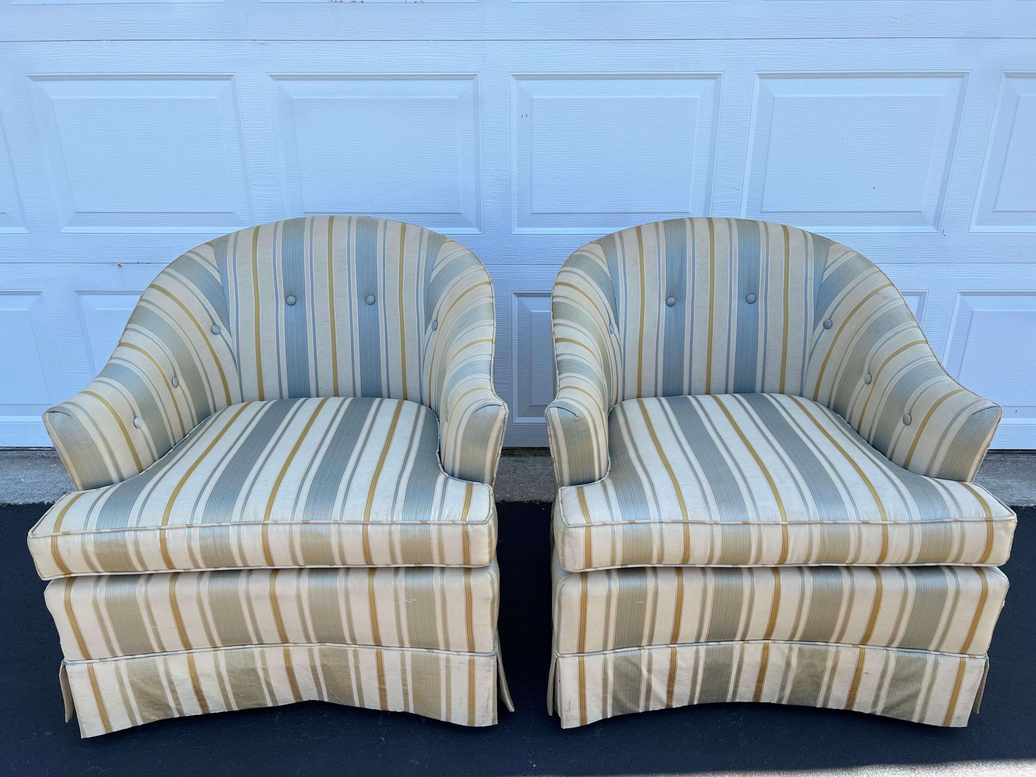 Pair of silk club chairs by Drexel Heritage. Classic tailored cube shape with buttons.
Could use a re-upholstery job , some tears in the silk, but excellent bones. No structural issues at all. These beauties have four tapered solid wooden legs. 