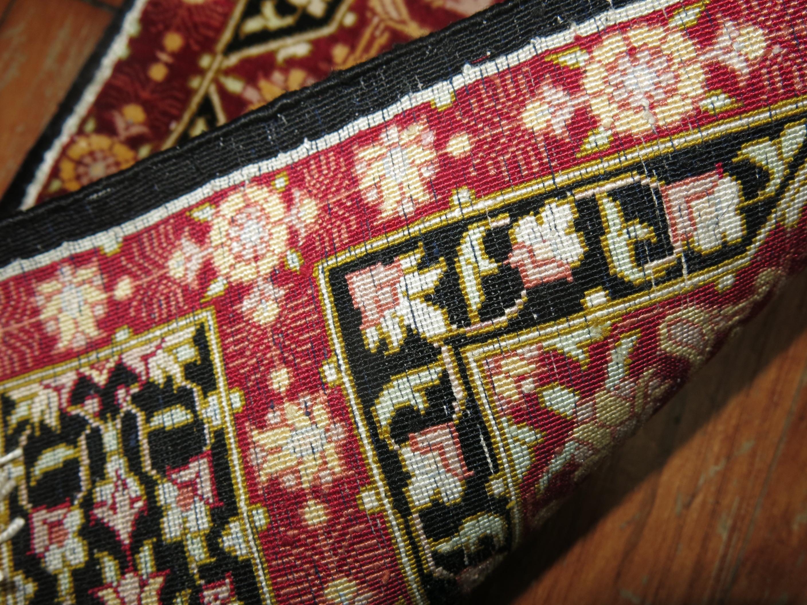 A pair of late 20th century silk Persian Qum rugs.

 