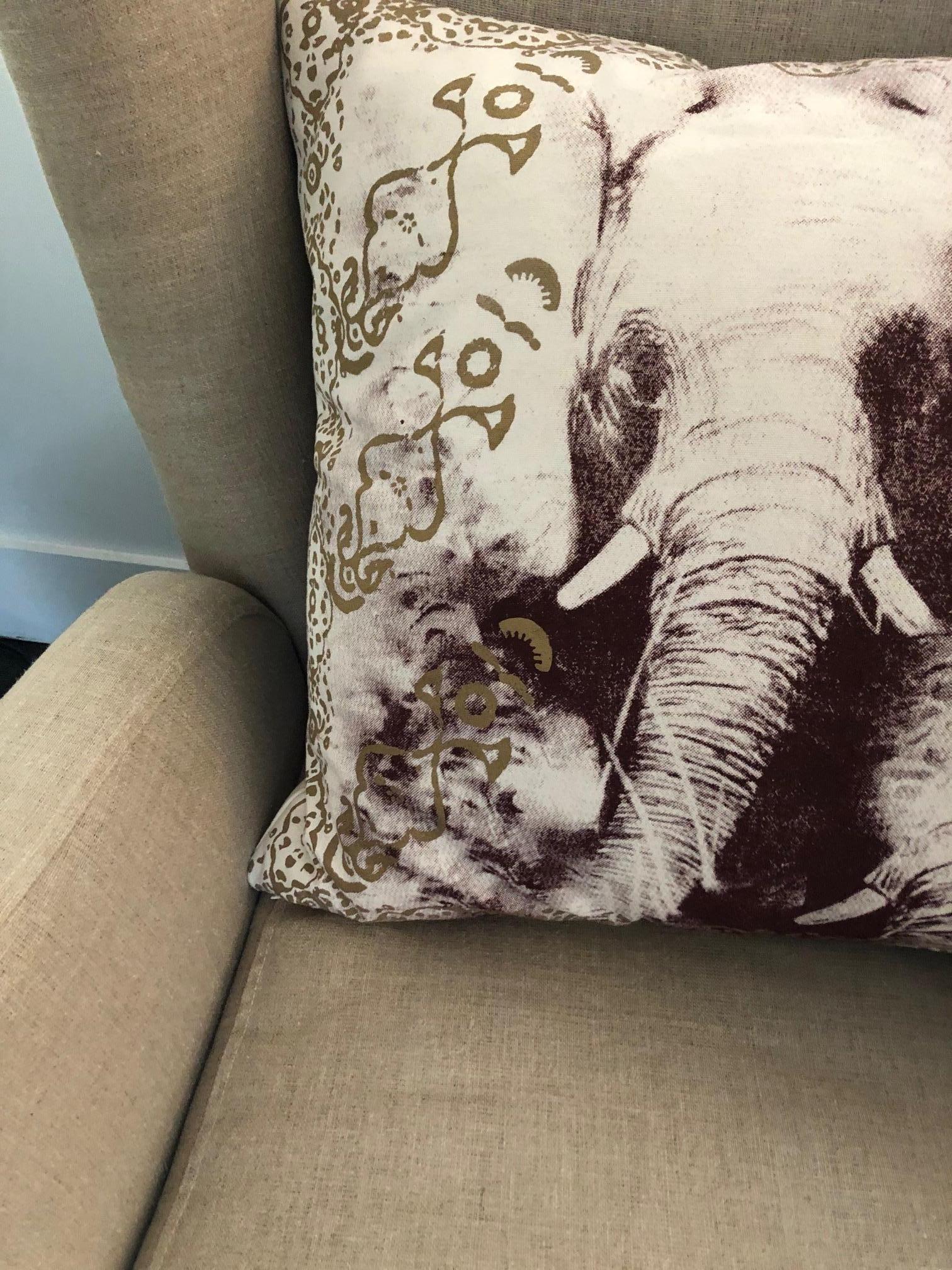 Silk screened image of an elephant with decorative border around pillow, design is the same on reverse side. Screened on raw cotton, has a poly/dac inserts. Sold as a pair only. Made in USA.