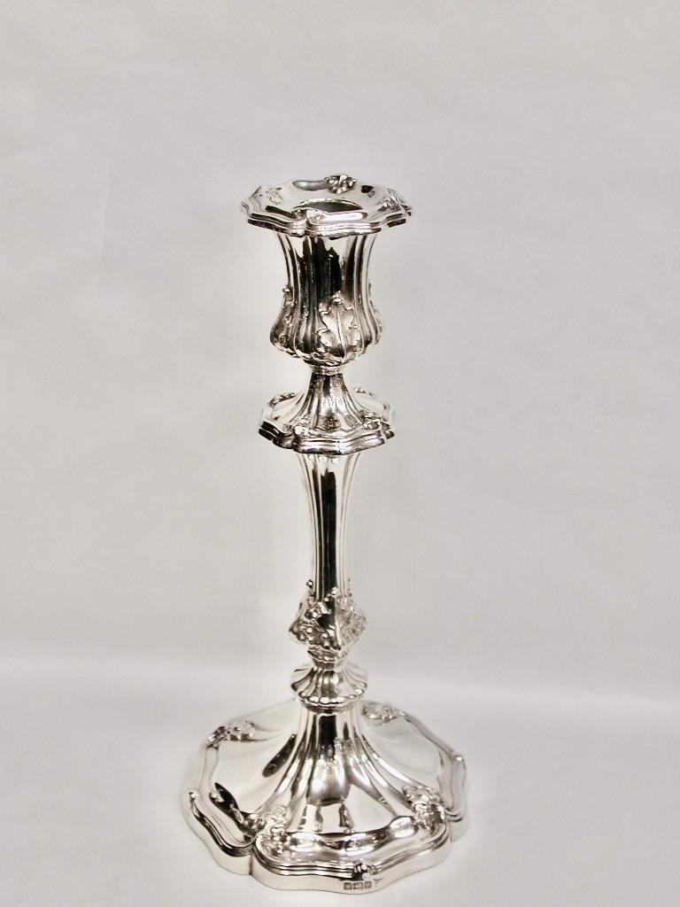 Pair of Silver 10.25 Inch Candlesticks,Made By Walker & Hall of Sheffield, 1913.
This style of candlestick was around in the 1830's
They have a slight melon shape with nice leafwork on the highlights.
Walker & Hall were well known at that time