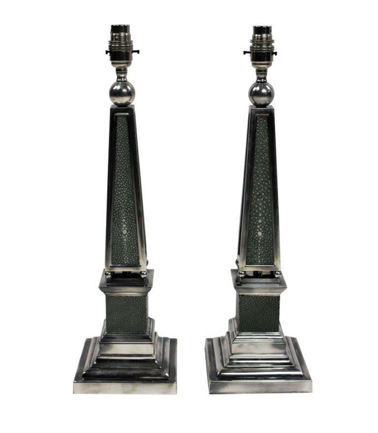 A pair of English silver plated obelisk lamps covered in antique shagreen.

These lamps are made to order for Ebury Trading.

Subjected to VAT. 
   