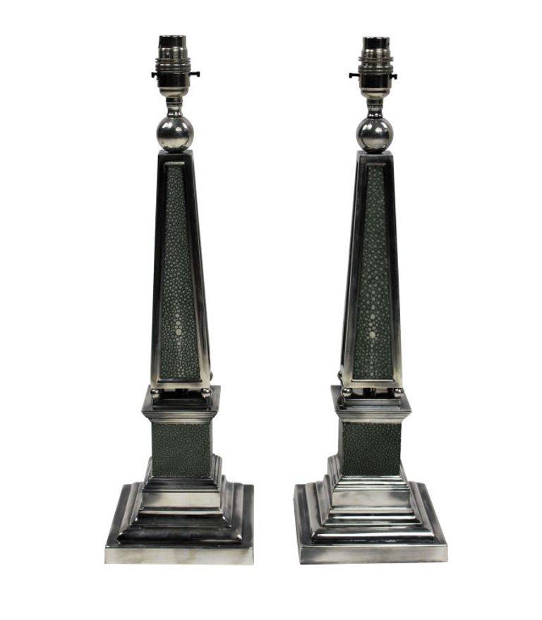 A pair of English silver plated obelisk lamps covered in antique shagreen.

These lamps are made to order for Ebury Trading.

Subjected to VAT. 
  