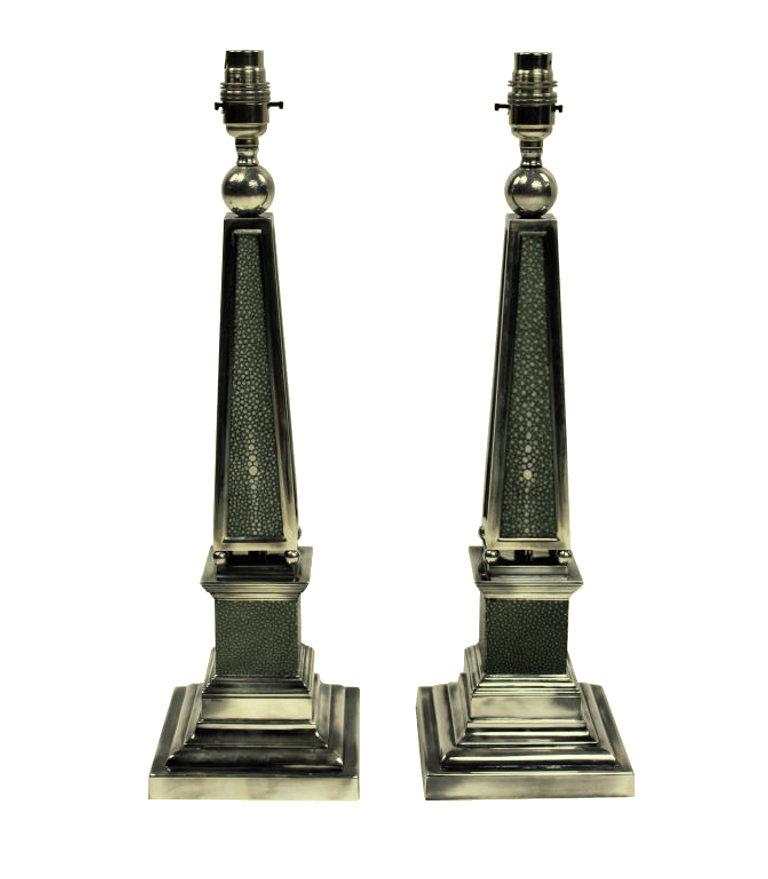 A pair of English silver plated obelisk lamps covered in antique shagreen.
  