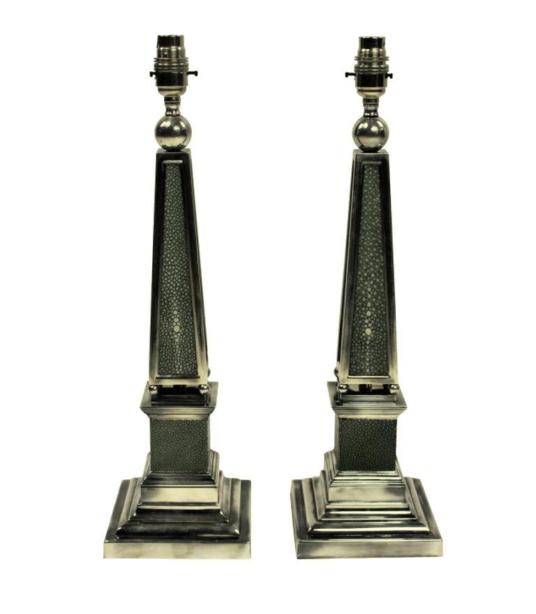 A pair of English silver plated obelisk lamps covered in antique shagreen.
 