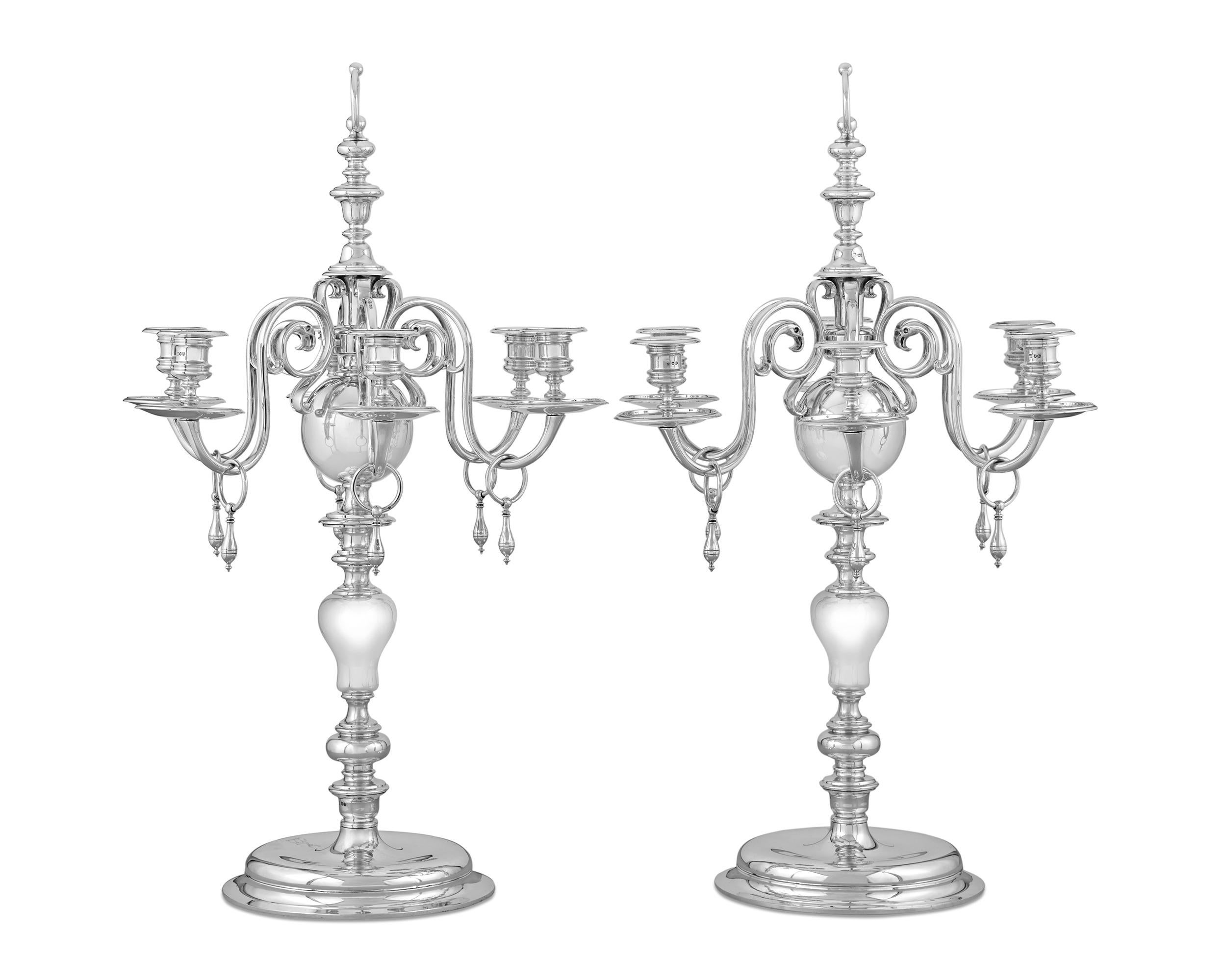 This important set of George V silver candelabra by famed English silversmiths Thomas Bradbury & Sons are some of the finest the firm ever created. A high level of refinement is imparted into this weighty six-light design. Based on the early