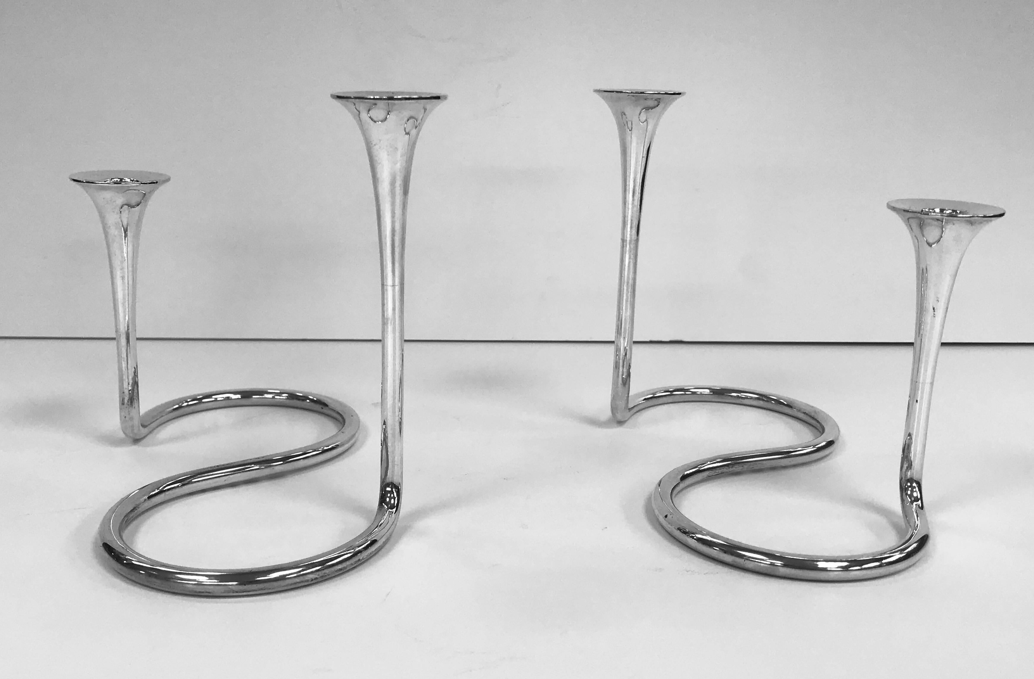 A pair of unusual silver candelabra made in Denmark, by Michelsen, circa 1960.