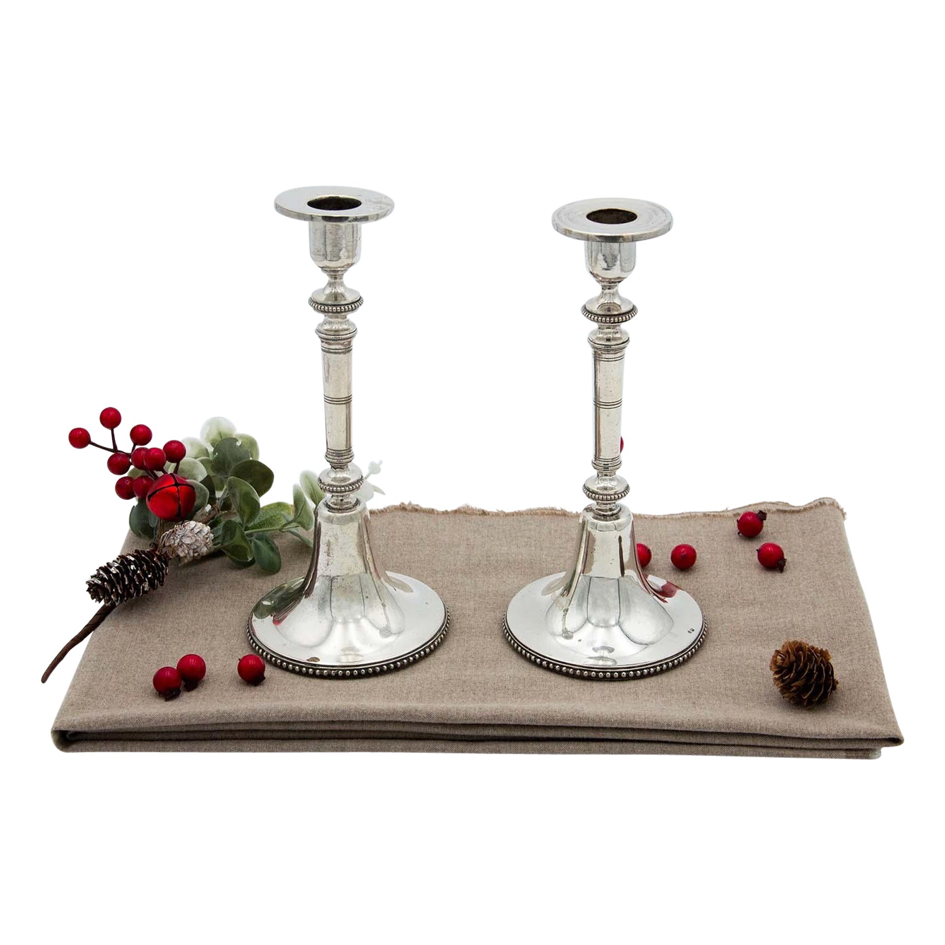 Pair of silver candlesticks w/ pearl trim 
trim on the stems 
circular bases