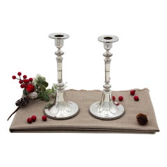 Pair of silver candlesticks w/ pearl trim 
trim on the stems 
circular bases