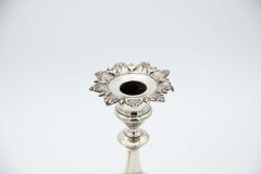 Pair of silver candlesticks with acanthus leaf engravings