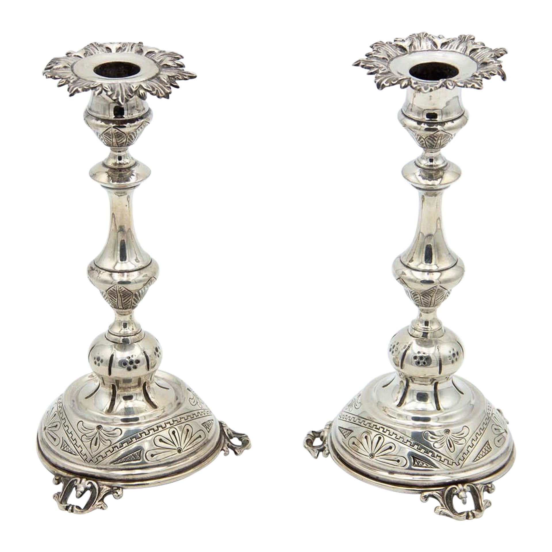 Pair of silver candlesticks with acanthus leaf engravings