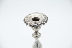 Pair of silver candlesticks with flower-shaped sconces