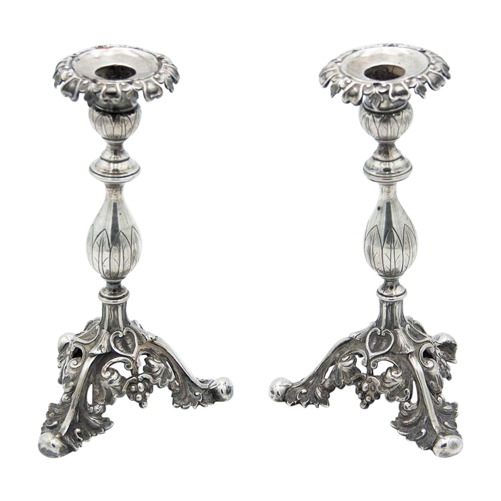Pair of silver candlesticks with flower-shaped sconces