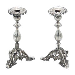 Pair of silver candlesticks with flower-shaped sconces
