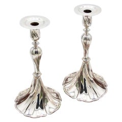 Pair of silver candlesticks with spiral trim and removable stems