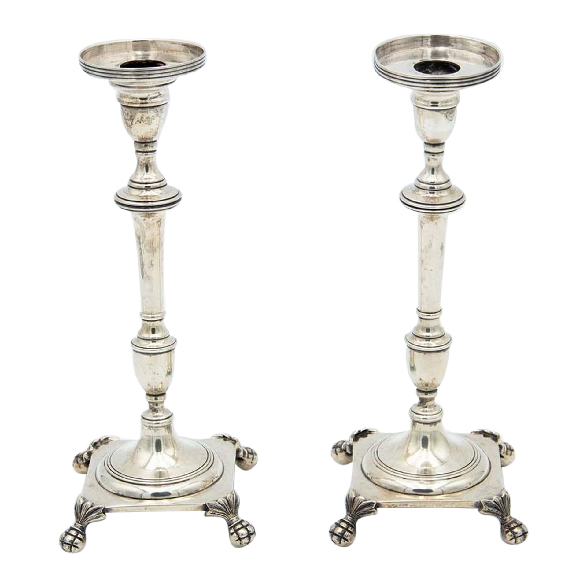 Pair of silver candlesticks with square bases