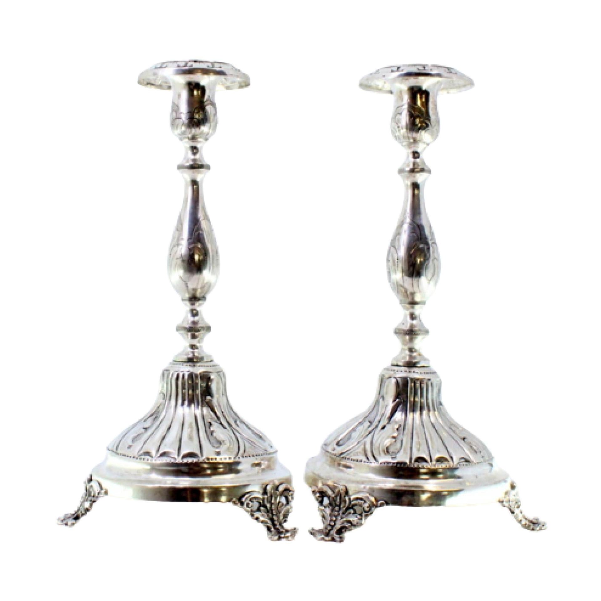 Pair of silver candlesticks with turned engraved shafts on three-foot bases For Sale