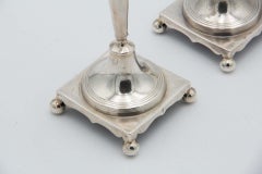 Pair of silver candlesticks with turned stems