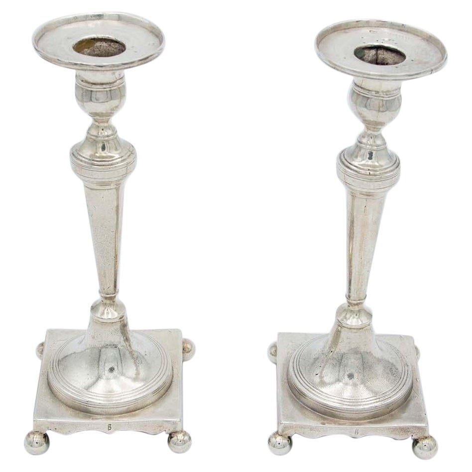 Pair of silver candlesticks with turned stems