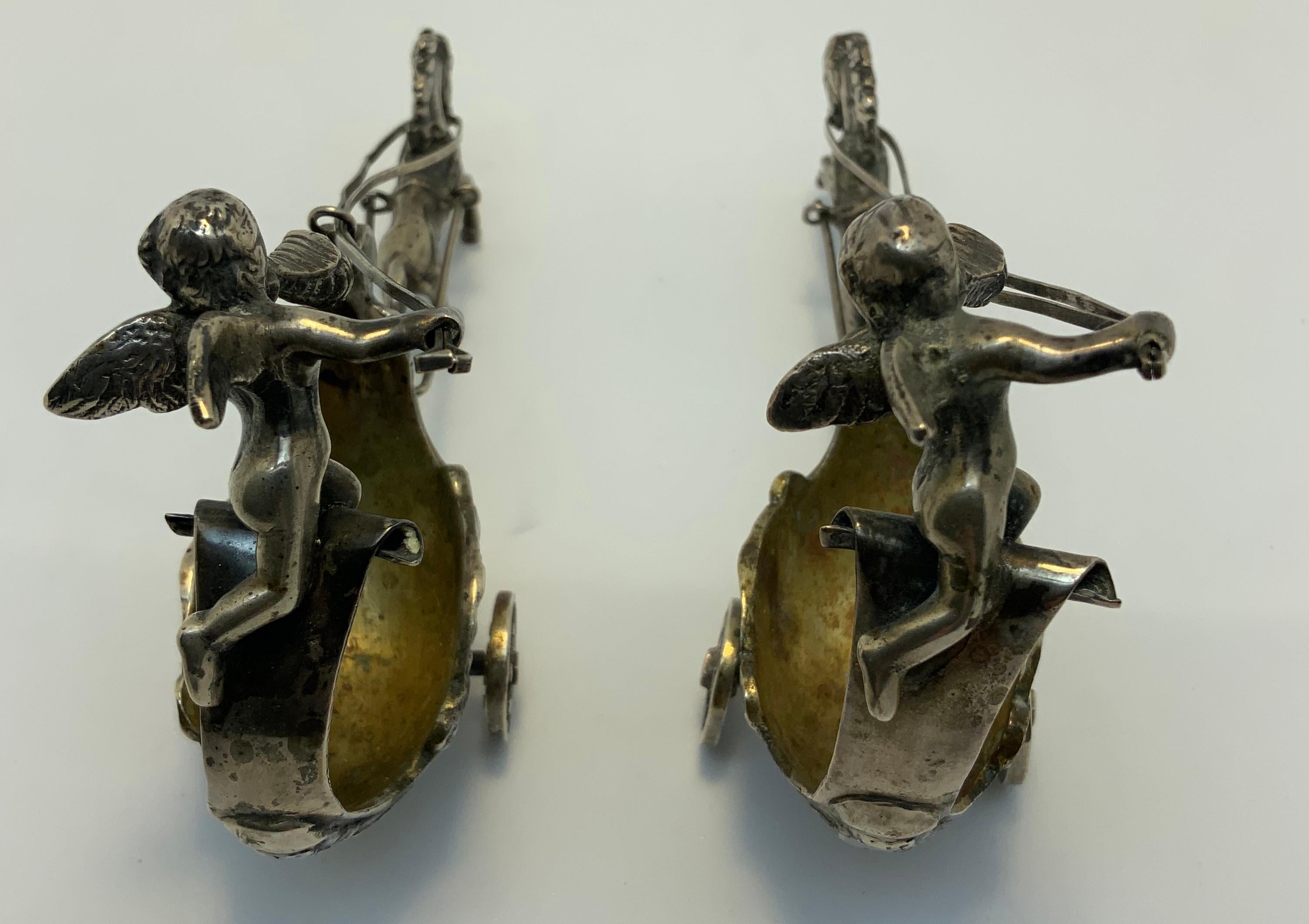Rococo Revival Pair of Silver Chariots Driven by Winged Cherub Salt Cellars