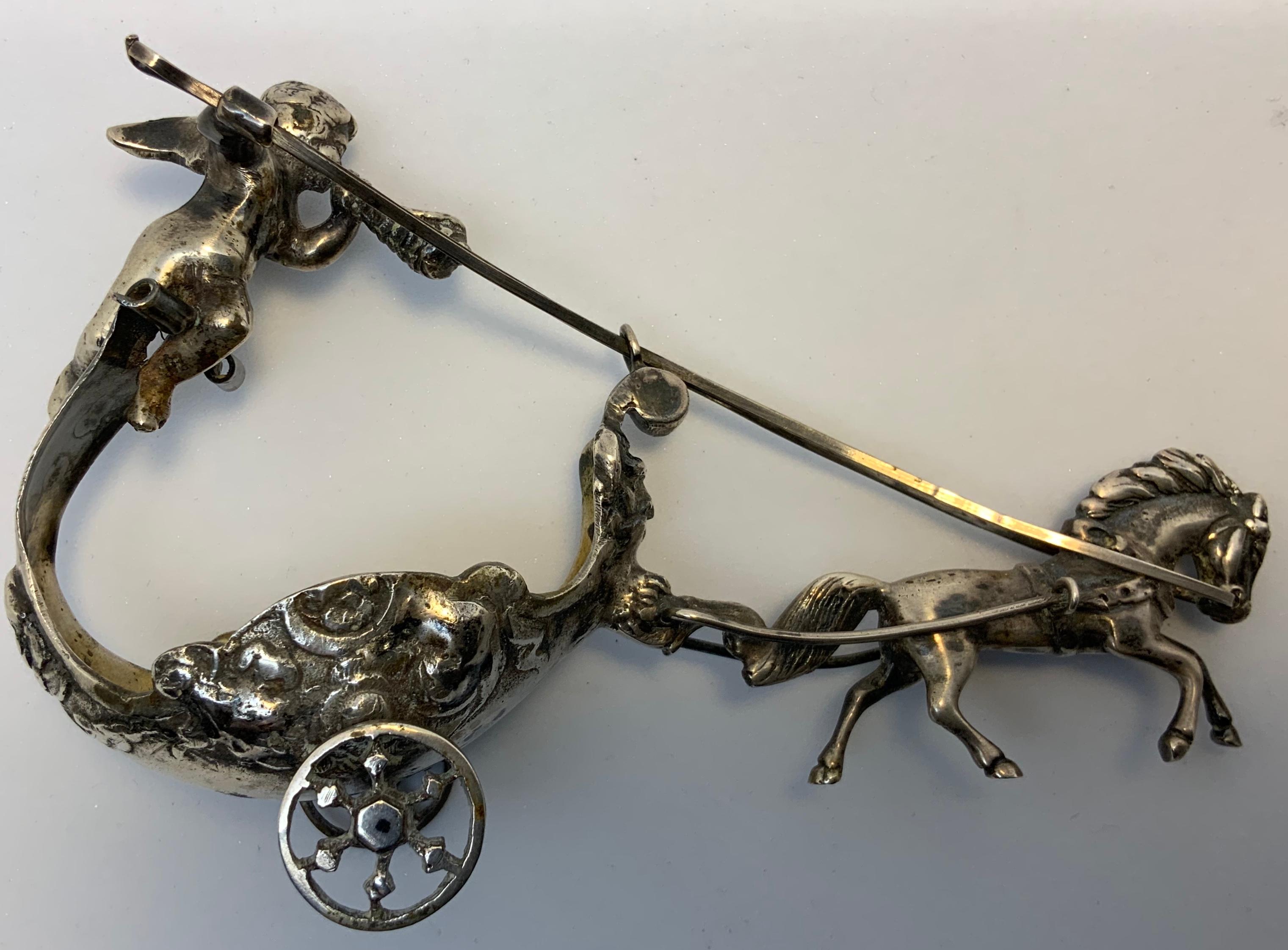 Embossed Pair of Silver Chariots Driven by Winged Cherub Salt Cellars