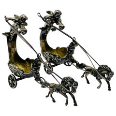 Pair of Silver Chariots Driven by Winged Cherub Salt Cellars