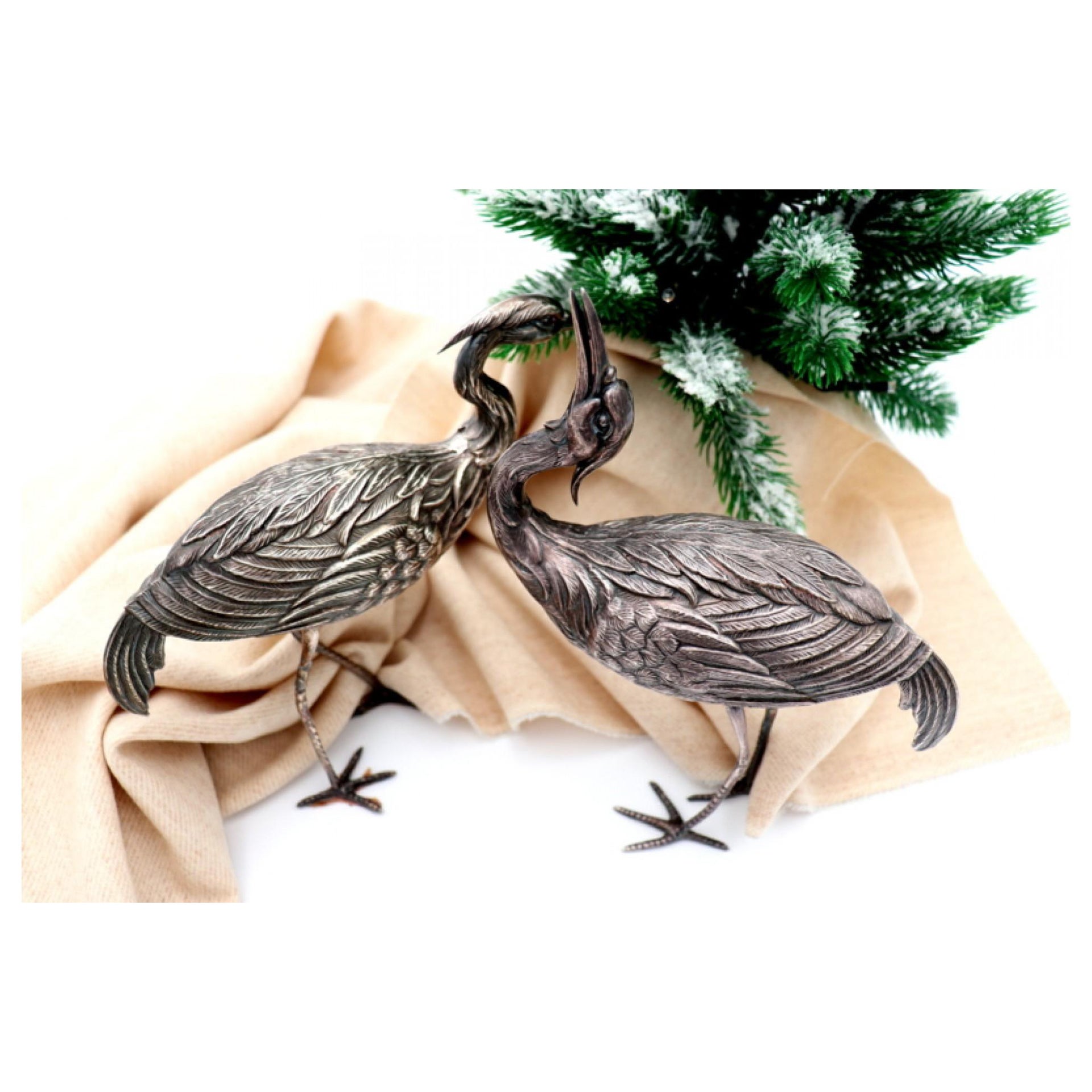 Pair of silver cranes with profusely embossed applications For Sale