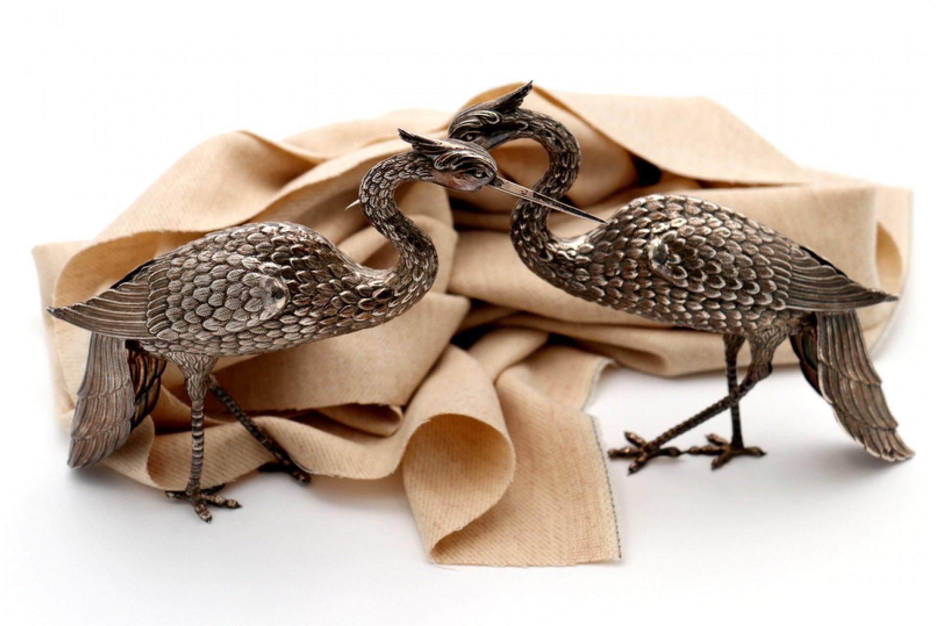 Pair of silver cranes with profusely embossed applications For Sale