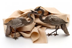 Pair of silver cranes with profusely embossed applications