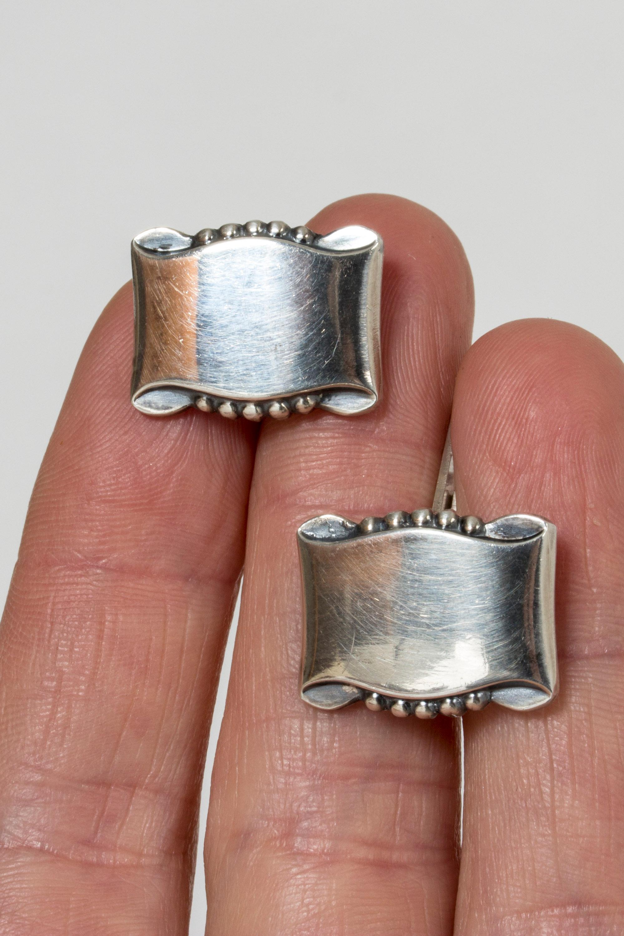 Pair of elegant silver cufflinks from Gustaf Dahlgren & Co. Bowlike, understated design.
