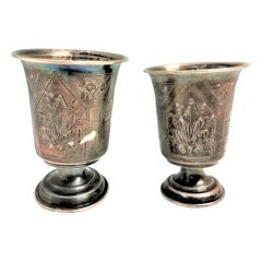 Pair of silver cups with Russian-style engraving