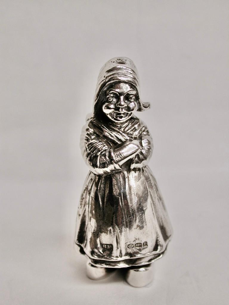 Pair of silver dutch girl salt & pepper shakers by Berthold Muller.
Made of cast sterling silver by Berthold Muller with larger holes for salt and smaller for pepper.
Imported into London in 1910 and 1912.
Made of a heavy guage of silver.