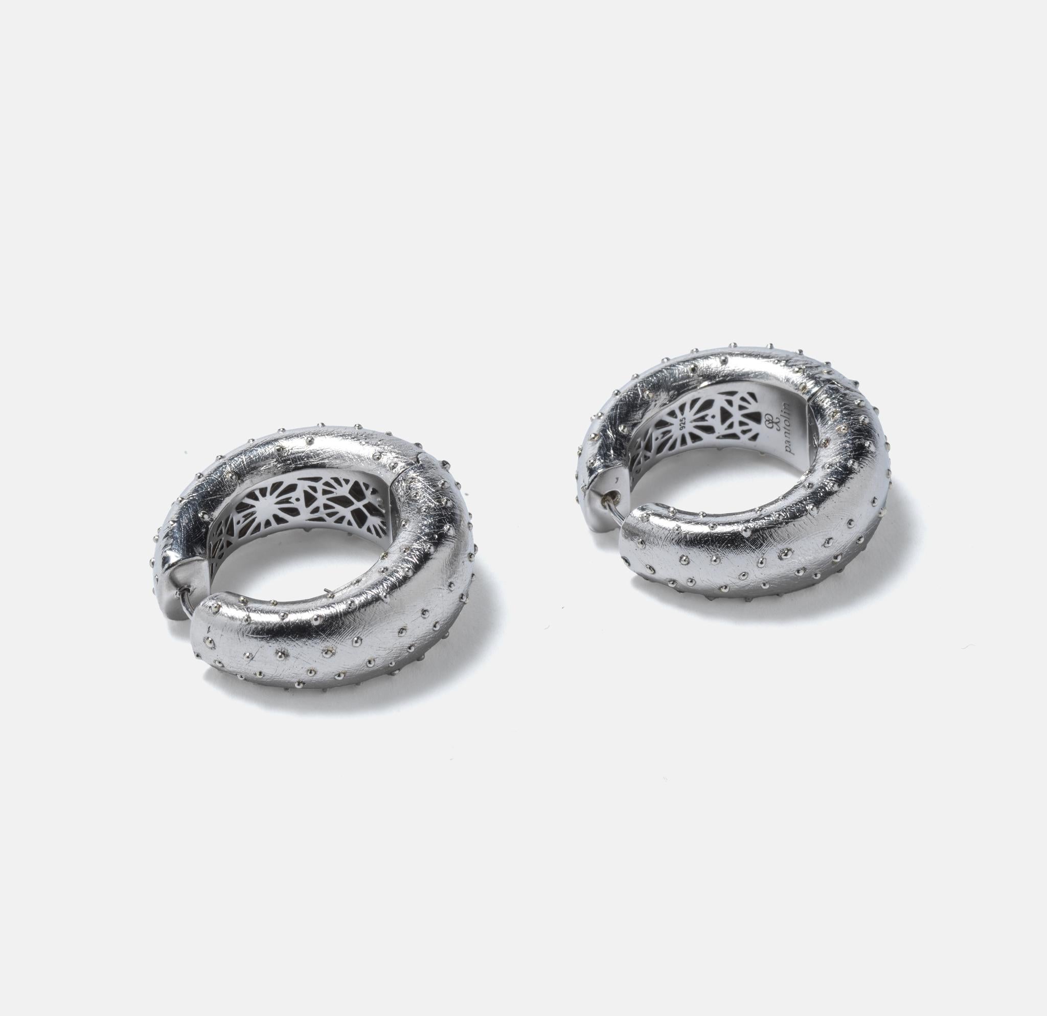 Women's or Men's Pair of silver ear rings by Swedish designer Paula Pantolin. For Sale