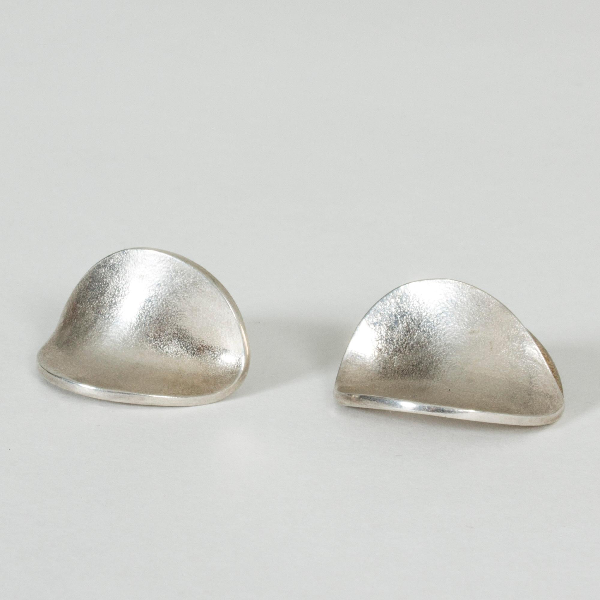 Pair of beautiful silver earrings by Björn Weckström. Flower petal like design with a frosty surface.