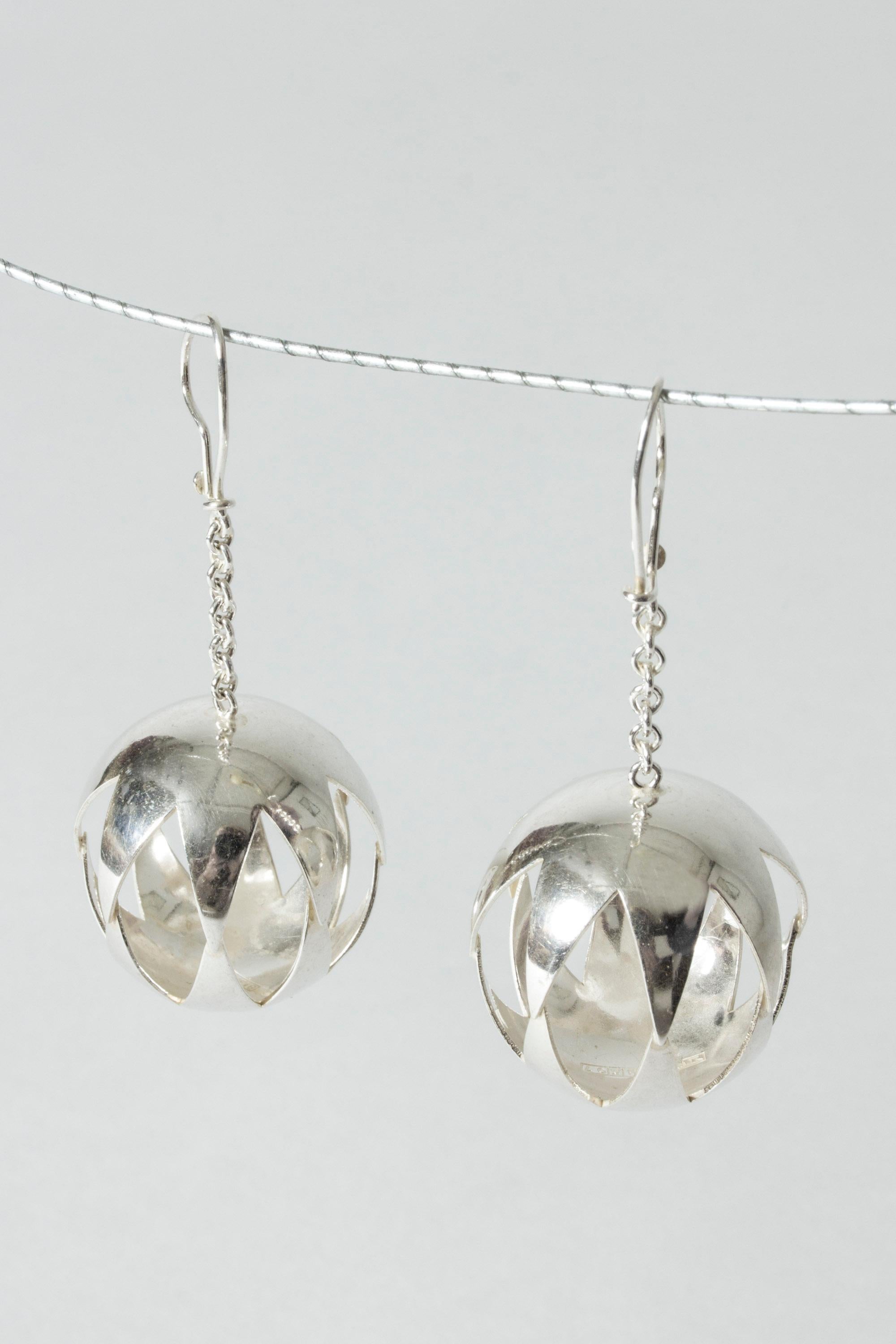Pair of amazing, oversized earrings by Elis Kauppi. Two large spheres, cutout with a graphic diamond pattern. Fun, beautifully made statement pieces.