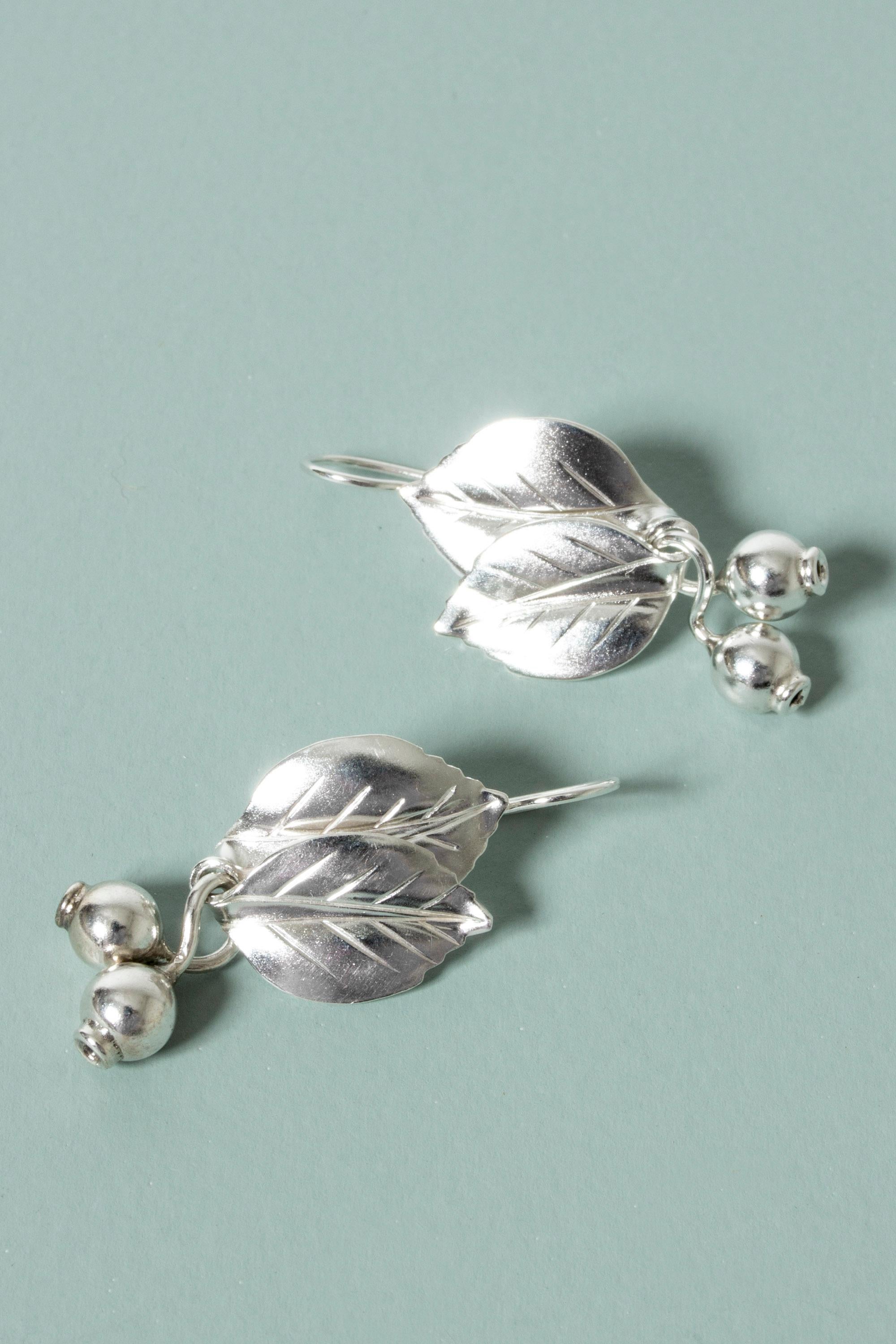 Pair of exquisite silver earrings by Gertrud Engel, made in the form of leaves with berries hanging from the bottom. Beautiful execution!
