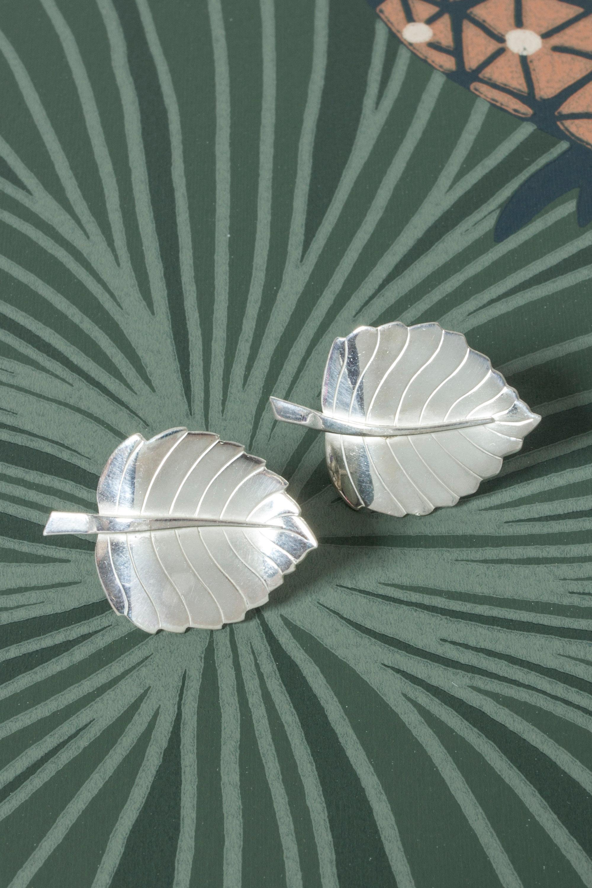 Pair of amazing silver earrings by Sigurd Persson, in the form of large leaves. Elegantly made with attention to detail in the veins and scalloped edges.