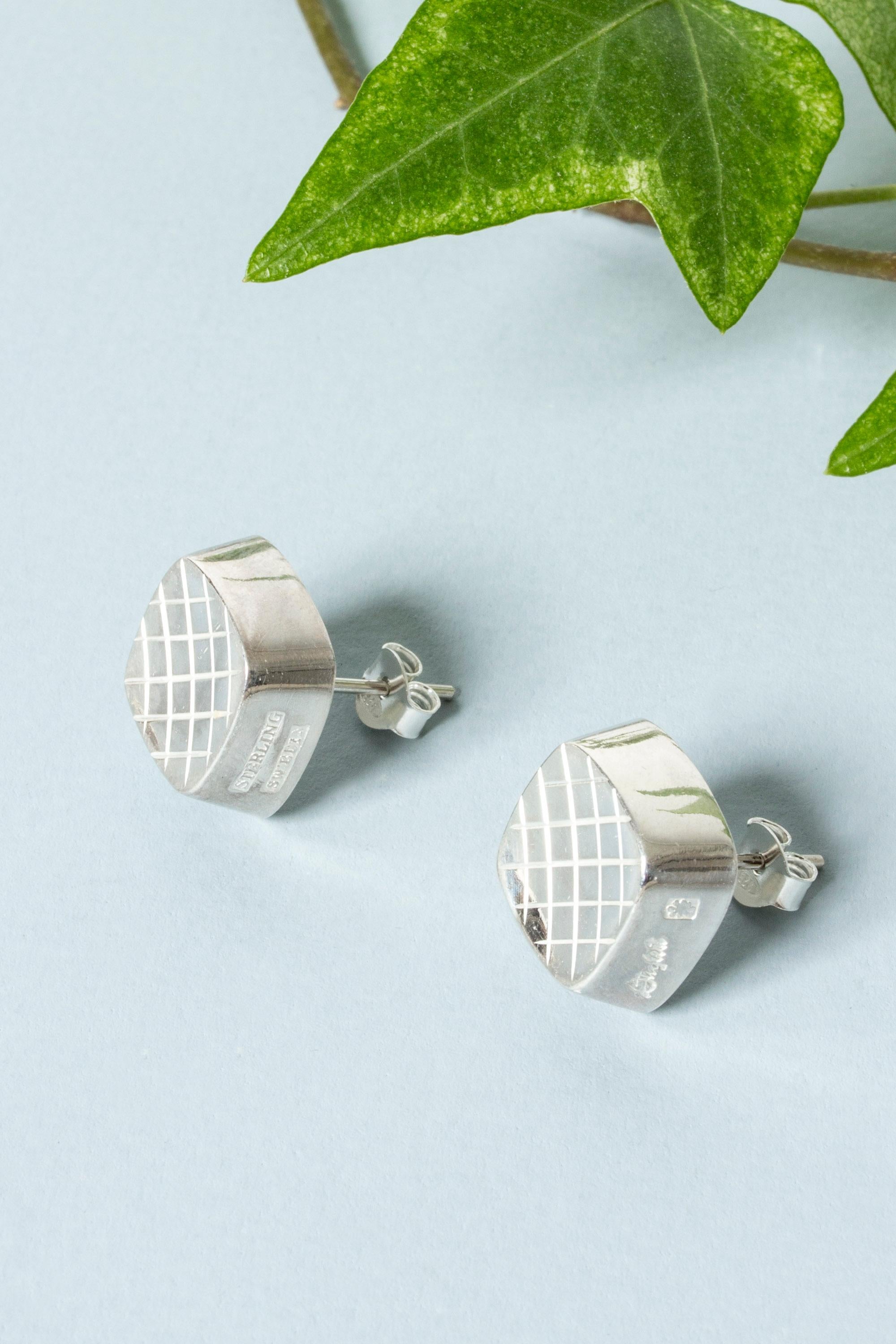 Pair of beautiful silver earrings from Stigbert, in an elegant bell-like form. Modernist, smooth design with organic influences.