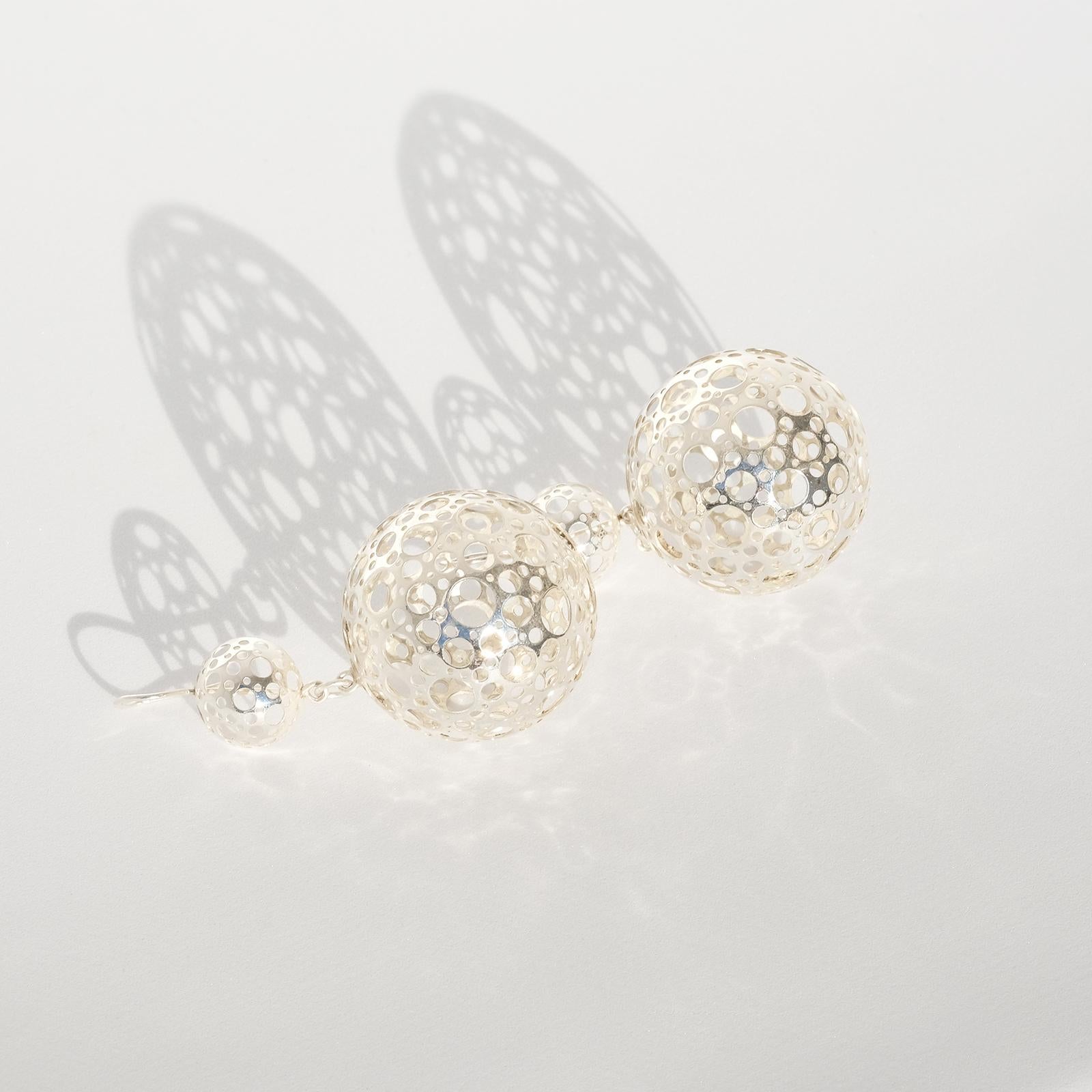 These sterling silver earrings are part of Liisa Vitali's famous serie “Leppäkerttu”, which means ladybug. The earrings have a round shape and are adorned with Vitali's signature pattern of circular cut-outs.

These earrings will not be ignored by