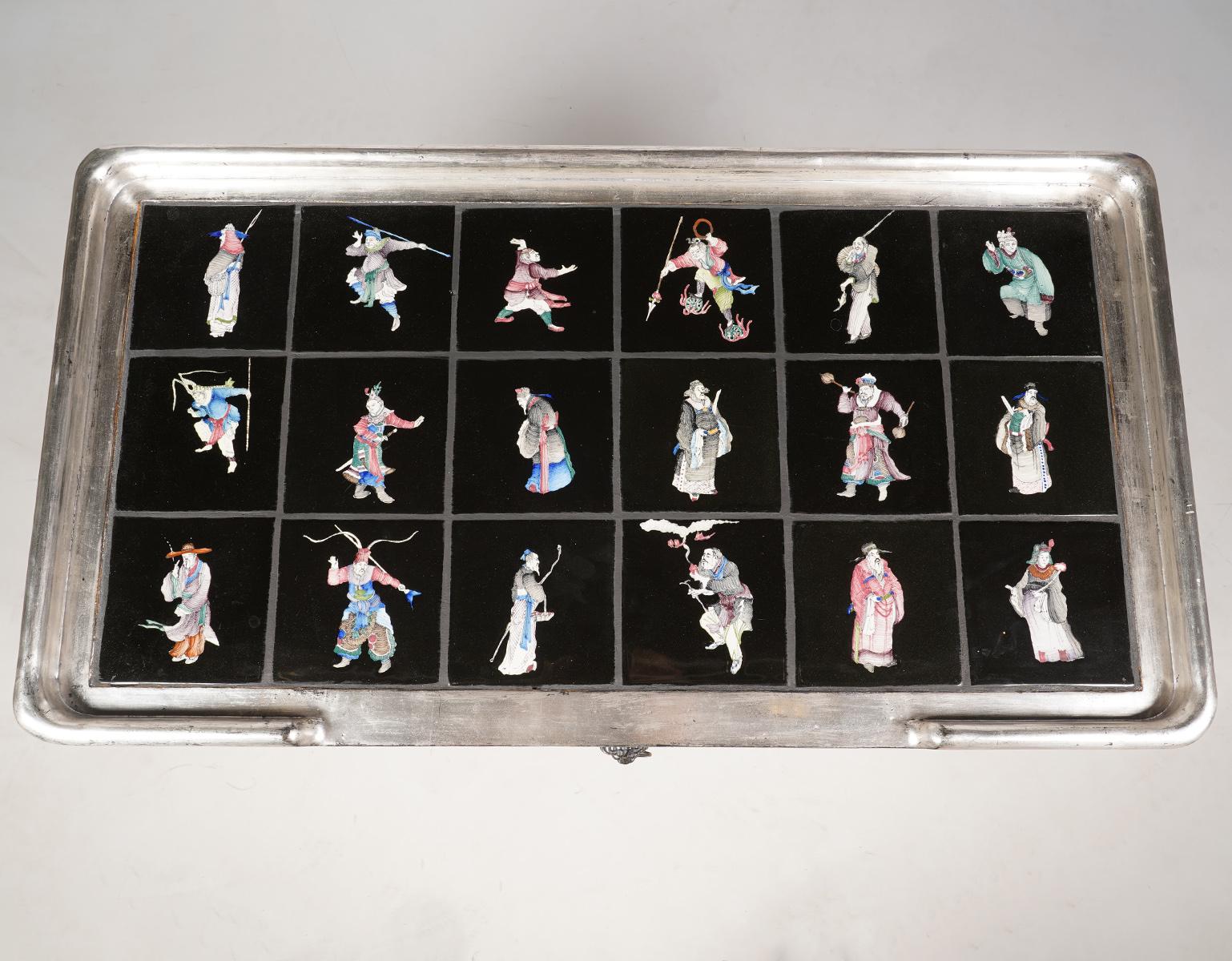 This unique pair of French silver gilt and gray painted tables, dating to the second half of the 20th century, feature ceramic glazed tile tops. The tiles are individually painted on a black background displaying a wealth of Japanese figures and