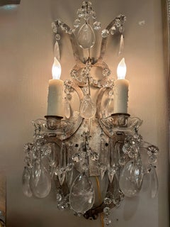 Pair of silver gilt metal sconces with rock crystal prisms