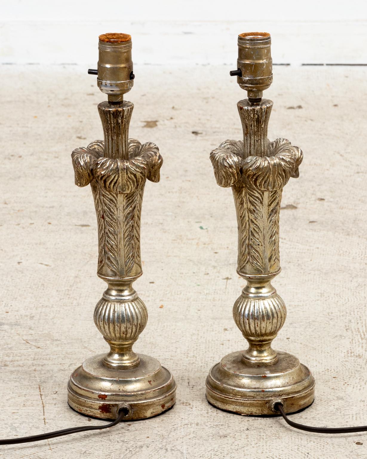 Circa mid-20th century Hollywood Regency style pair of plume form silvered gilt wood table lamps on rounded bases in the manner of Maison Jansen. Please note of wear consistent with age. Shades not included.