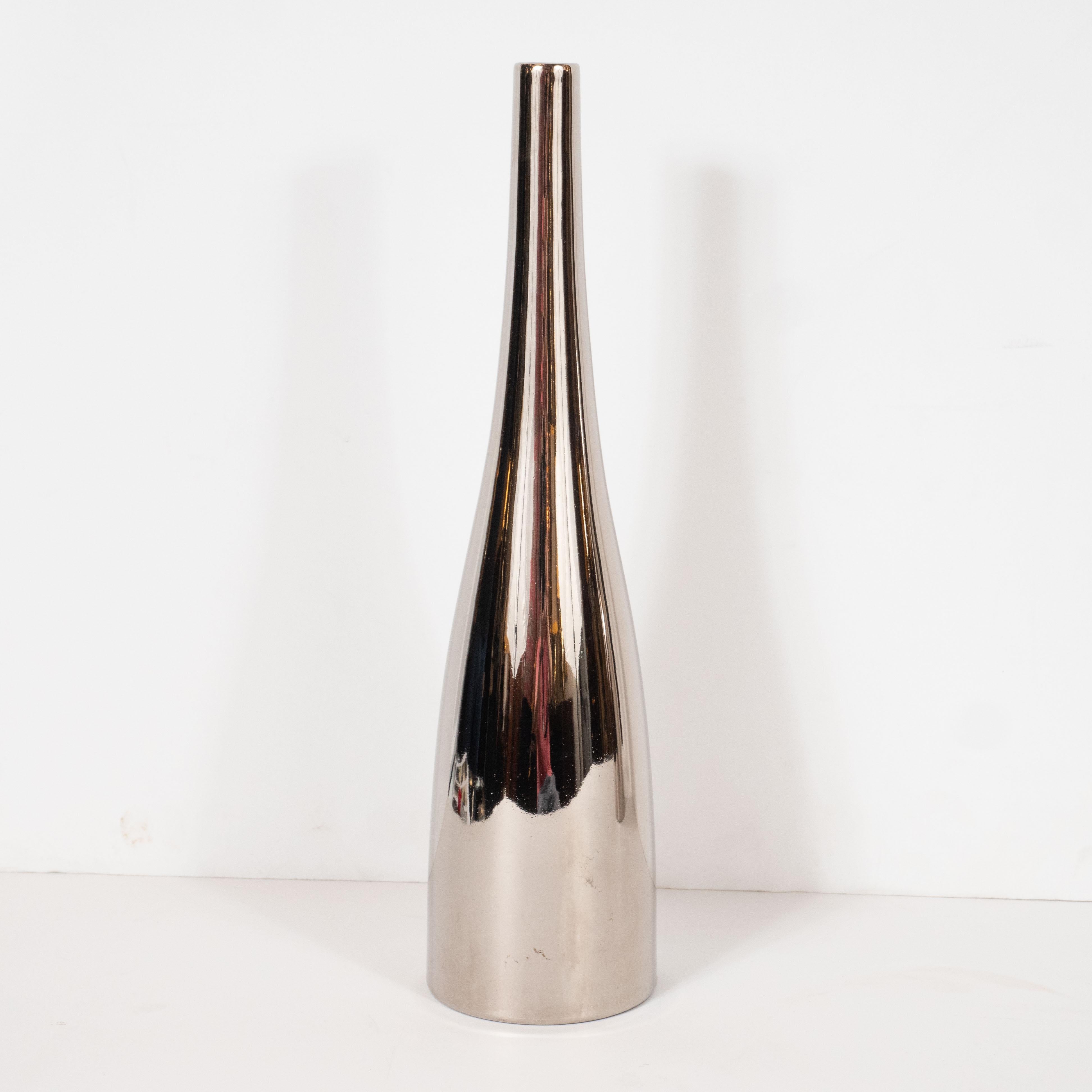 This stunning pair of Mid-Century Modern vases were designed by the esteemed Jacques Molin for Faiencerie de Charolles in France. Handmade in France, these conical ceramic vases offer elegantly attenuated proportions- a conical body and slender
