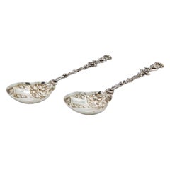 Pair of silver ice-cream spoons with Putti handles and floral shells