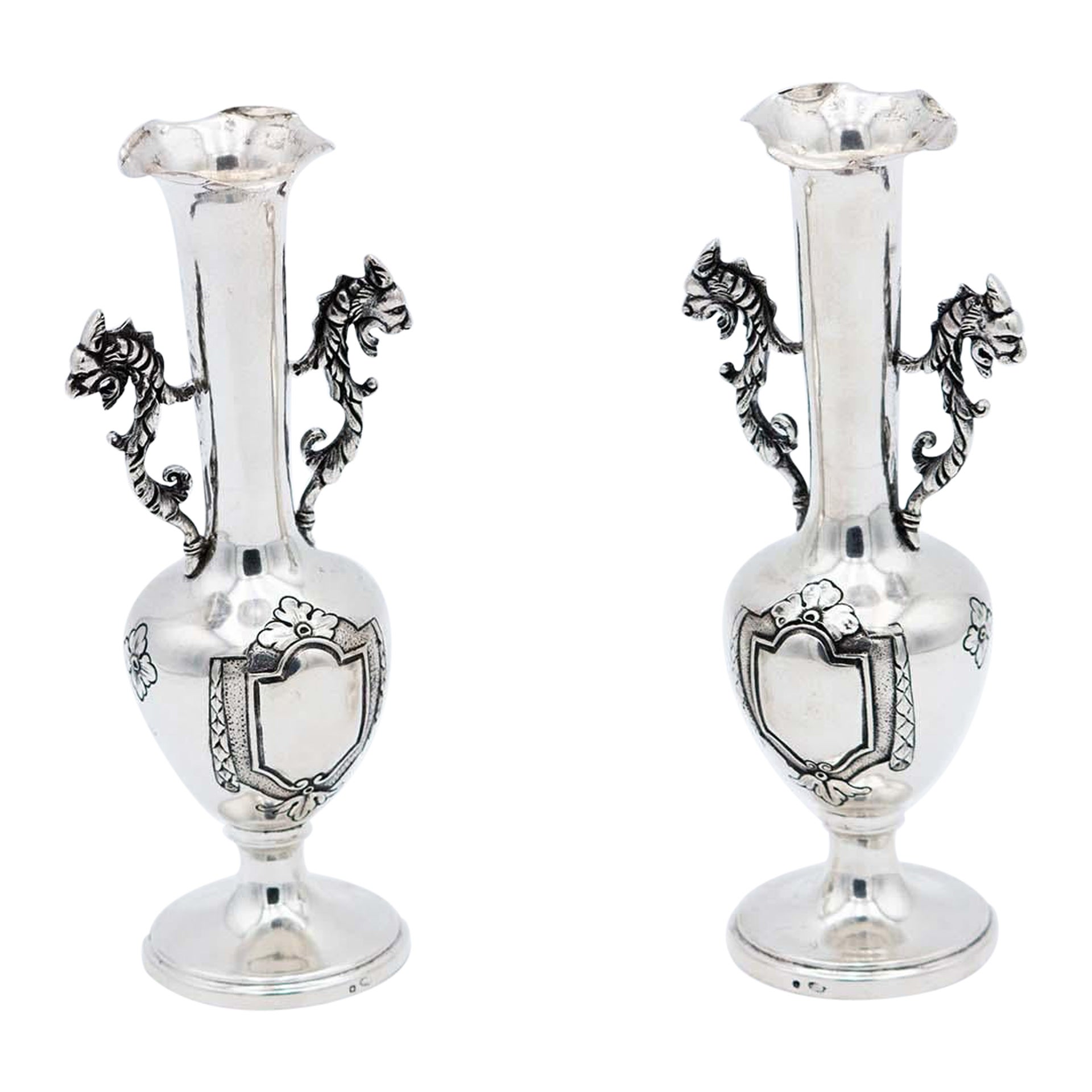 Pair of silver jugs with handles