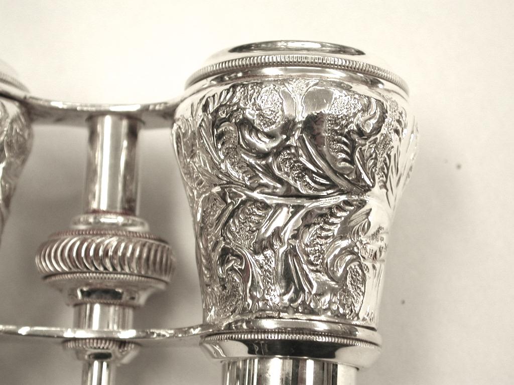 Pair of silver opera glasses with silver plated fittings, dated 1893.
Made in Birmingham by Barnett Henry Abrahams, who was known for making silver opera glasses.
The middle grooved button twists round to find each individual person's focus.