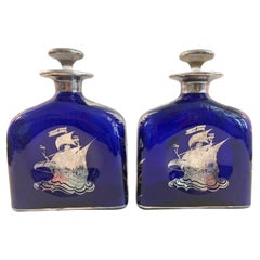 Pair of Silver Overlay Cobalt Decanters with Sailing Ships and Thistles