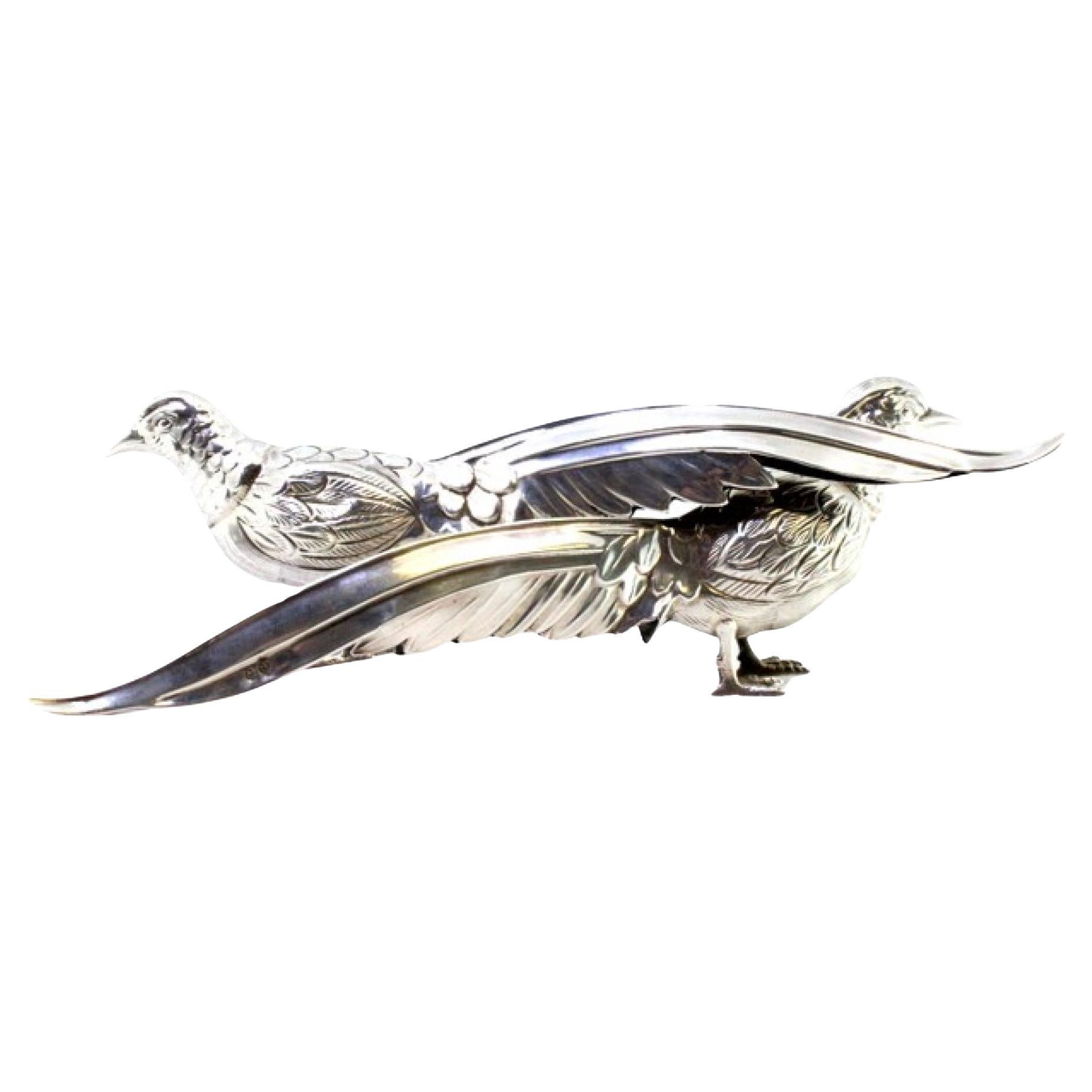 Pair of silver pheasants with reliefs and applications
